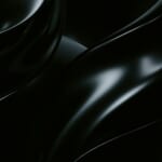 暗闇に光が反射する黒い曲面